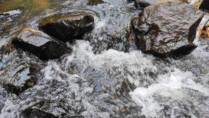 Abstract Defocused Blurred Photo of water ripples on the rocks in the river in the Cicalengka Tourism area - Indonesia. Not Focus