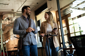 Business people in office talking. Beautiful businesswoman talking with colleagues..