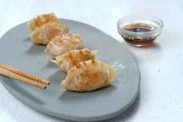  Gyoza or Jiaozi or mandu, asian dumpling with Dipping Sauce