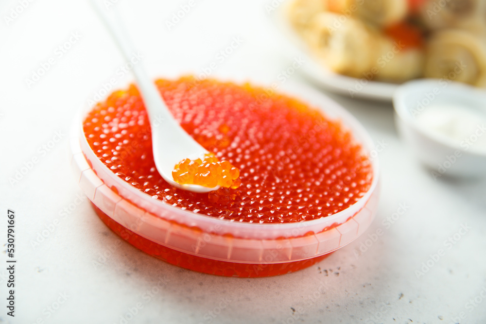 Poster salted red caviar in a container