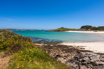 Fototapeta na wymiar The beach at Green Porth, Old Grimsby, Tresco, Isles of Scilly, UK: empty on a glorious Summer's day