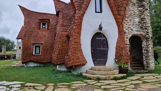 The Clay Castle from the Valley of Fairies, a touristic complex in Transylvania, Romania. Closeup view to a tiny entrance door, fantasy hobbit house from tales