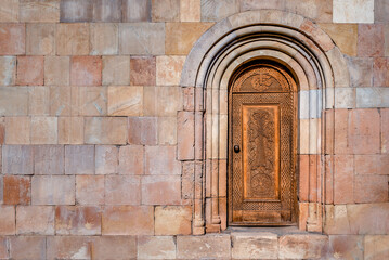 Beautiful Antique Wooden Door in the wall of Noravank Monastery in Armenia
