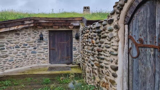 A hobbit house hidden underground part of the Clay Castle from the Valley of Fairies, a touristic complex in Transylvania, Romania