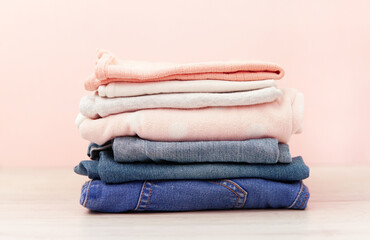 a stack of children's clothes for a girl. Jeans, tshirt