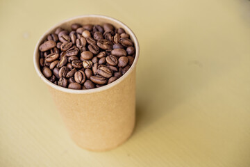 Freshly roasted coffee beans in a cup