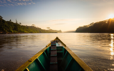 Early morning boat trip  on Tambopata River, Peruvian rainforest, Puerto Maldonado, Peru