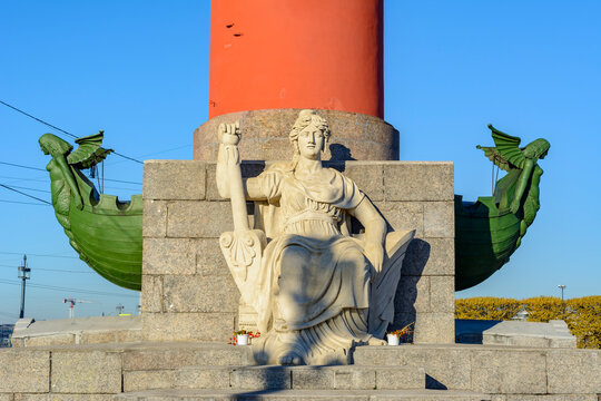 Statue at Rostral column in Saint Petersburg, Russia