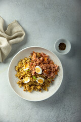 Pilau with salmon and quail eggs