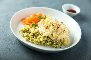 Scrambled eggs with couscous and smoked salmon