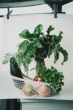 Backstage shooting a still life with vegetables and fruits. The concept of eco-friendly consumption and vegetarianism.