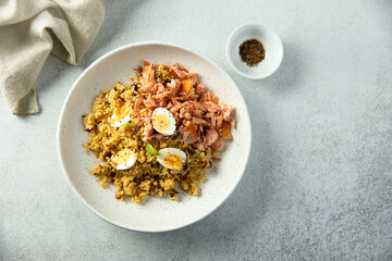Pilau with salmon and quail eggs