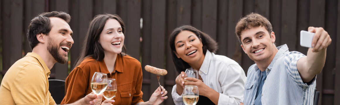 Cheerful Multiethnic Friends Taking Selfie During Bbq Party In Backyard , Banner