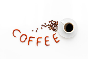 Black coffee - espresso - in white cup with coffee beans