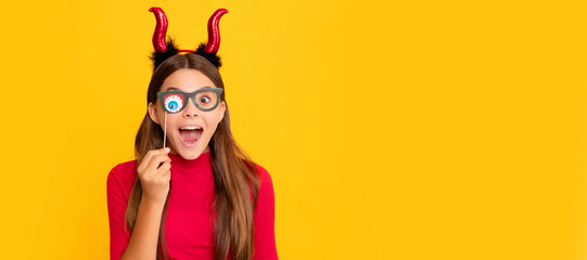 teen girl on yellow background. celebrate autumn party holiday. childhood fun. Halloween kid girl portrait, horizontal poster. Banner header with copy space.