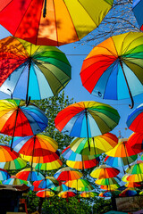 Fototapeta na wymiar Colorful rainbow umbrella street decoration for background