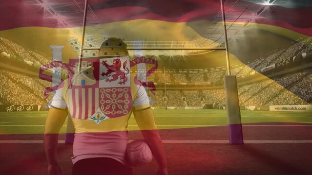 Animation of flag of spain over caucasian rugby player at stadium