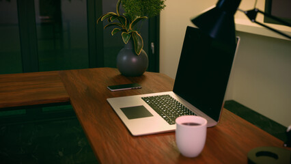 Laptop on desk with coffee cup