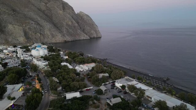Perissa Aerial View at Sunrise. Famous Volcanic Beach and Bay of Perissa Village, Santorini Island, Cyclades, Greece. 