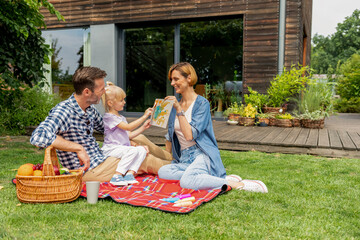 Family playing in backyard spending time together