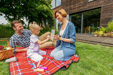 Family playing in backyard spending time together