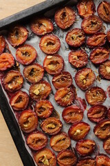 plum dried in the oven with spices and garlic for harvesting for the winter in jars delicacy