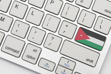 national flag of jordan on the keyboard on a grey background .3d illustration