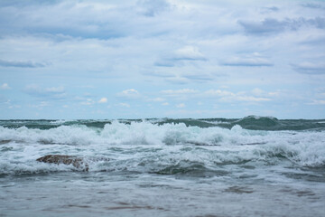 sea, sand, rocks, waves and a  very beautiful beach