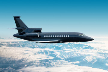 Modern black luxury private jet flies over snow-covered mountains