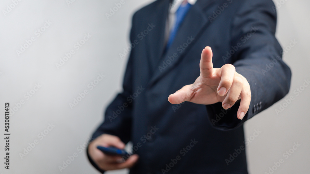 Poster businessman pressing button on virtual screen.copy space for text.