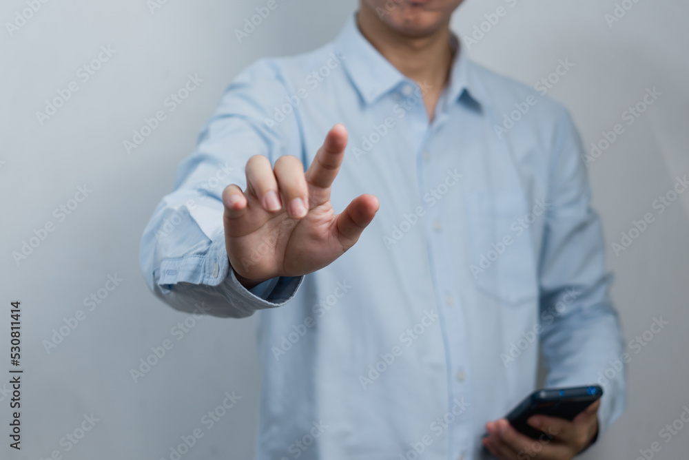 Aufkleber businessman pressing button on virtual screen.copy space for text.