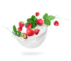Strawberries with leaves in milk splashes close-up isolated on a white background