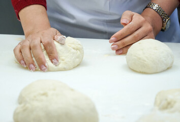 master making dough for bread