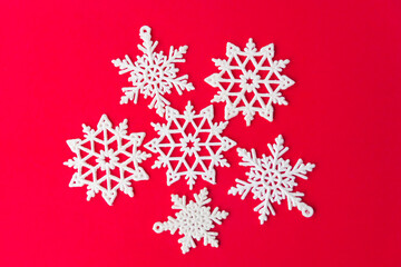 Christmas snowflake on red paper card Vintage Christmas postcard with snowflakes. Beautiful christmas white stars on a red background