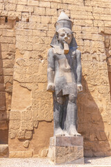 Luxor, Egypt; October 7, 2022 - A couple of statues of the pharaoh Ramses II at the Luxor Temple,...