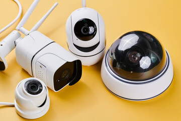 Surveillance cameras, set of different videcam, cctv cameras isolated on yellow background close...