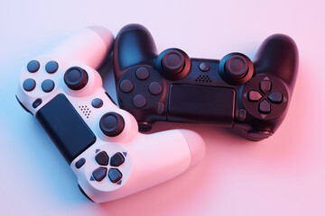 Two video game controllers, joysticks for game console isolated on white background. Gamer controlling devices close-up © amixstudio