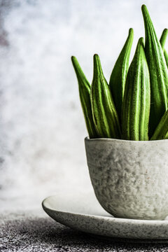 Raw okra in bowls