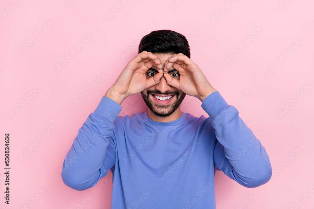 Poster Photo of funny funky arab guy dressed blue pullover showing arms eyewear isolated pink color background