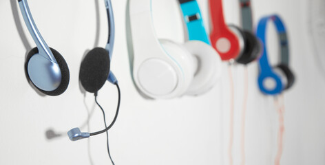 Headphones on the wall. Music. Technology