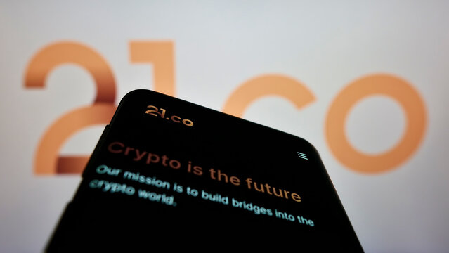 Stuttgart, Germany - 09-10-2022: Smartphone with webpage of crypto company Amun Holdings Limited (21.co) on screen in front of business logo. Focus on top-left of phone display.