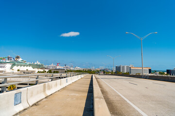 roadway with dock on the side and blue sky