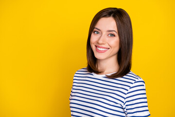 Fototapeta premium Portrait of pretty adorable gorgeous girl with bob hairstyle wear striped t-shirt toothy smiling isolated on yellow color background