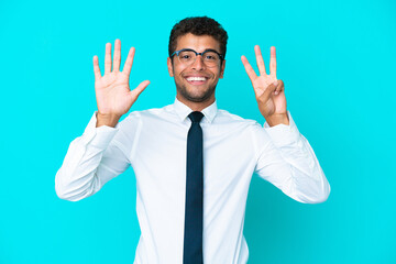 Young business Brazilian man isolated on blue background counting eight with fingers