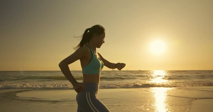 sport woman running on beach