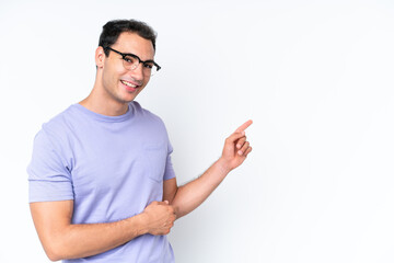 Young caucasian man isolated on white background pointing finger to the side