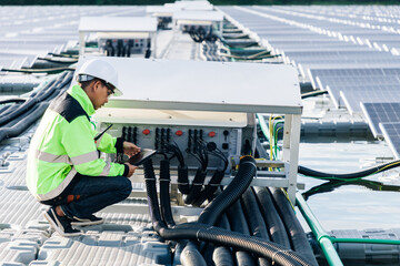The portrait of a asian young engineer checks photovoltaic solar panels. Concept. renewable energy technology electricity service, green power.