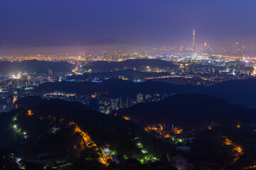 Fototapeta premium Twilight aerial view of the Neihu District cityscape from Bishanyan