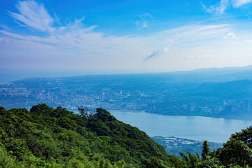 Aerial view of the Guanyin Shan Scenic Area and Taipei cityscape