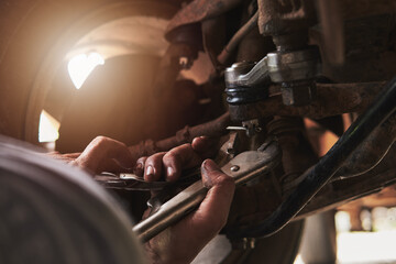 mechanic at work,Mechanic hand repairing car parts, man hand repairing a car close up